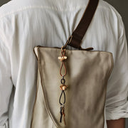 Kay Bojesen Monkey Bag Charm, Teak/Limba, styled view