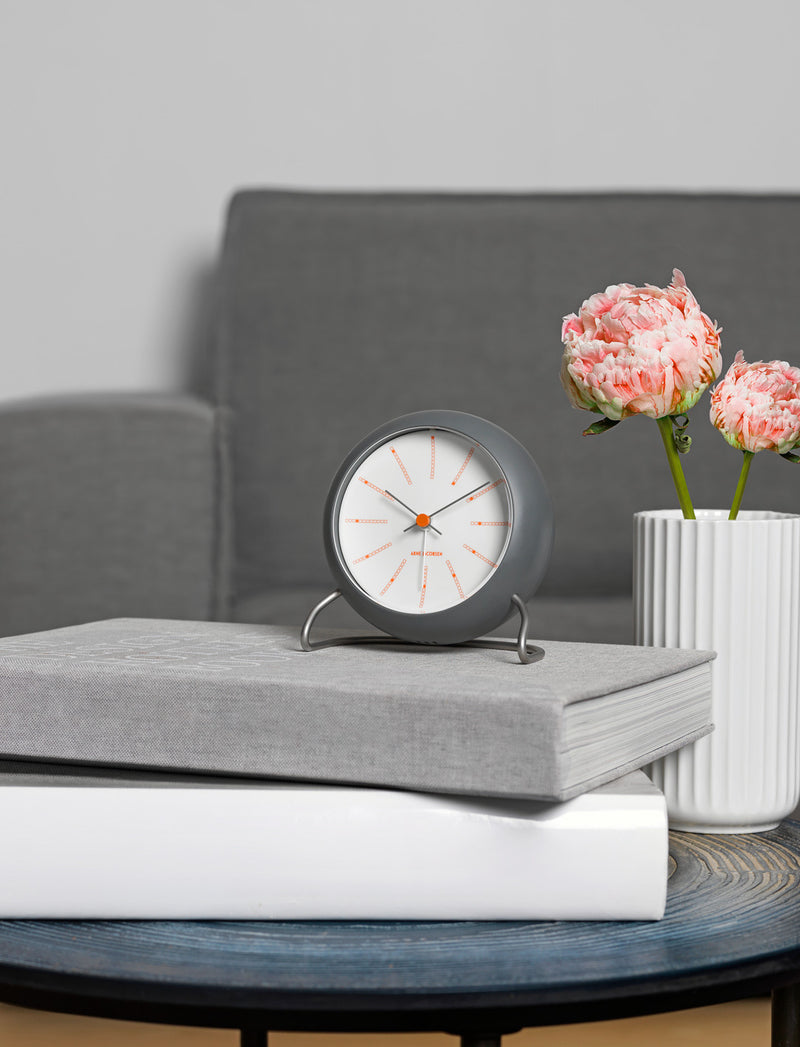 Arne Jacobsen Bankers Table Clock in Dark Grey in an interior setting