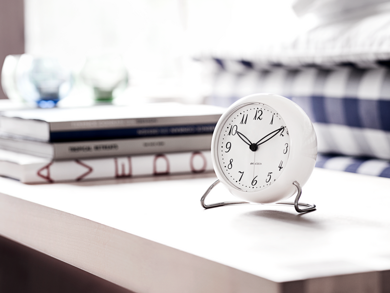 Arne Jacobsen LK Table Clock in White in an interior setting