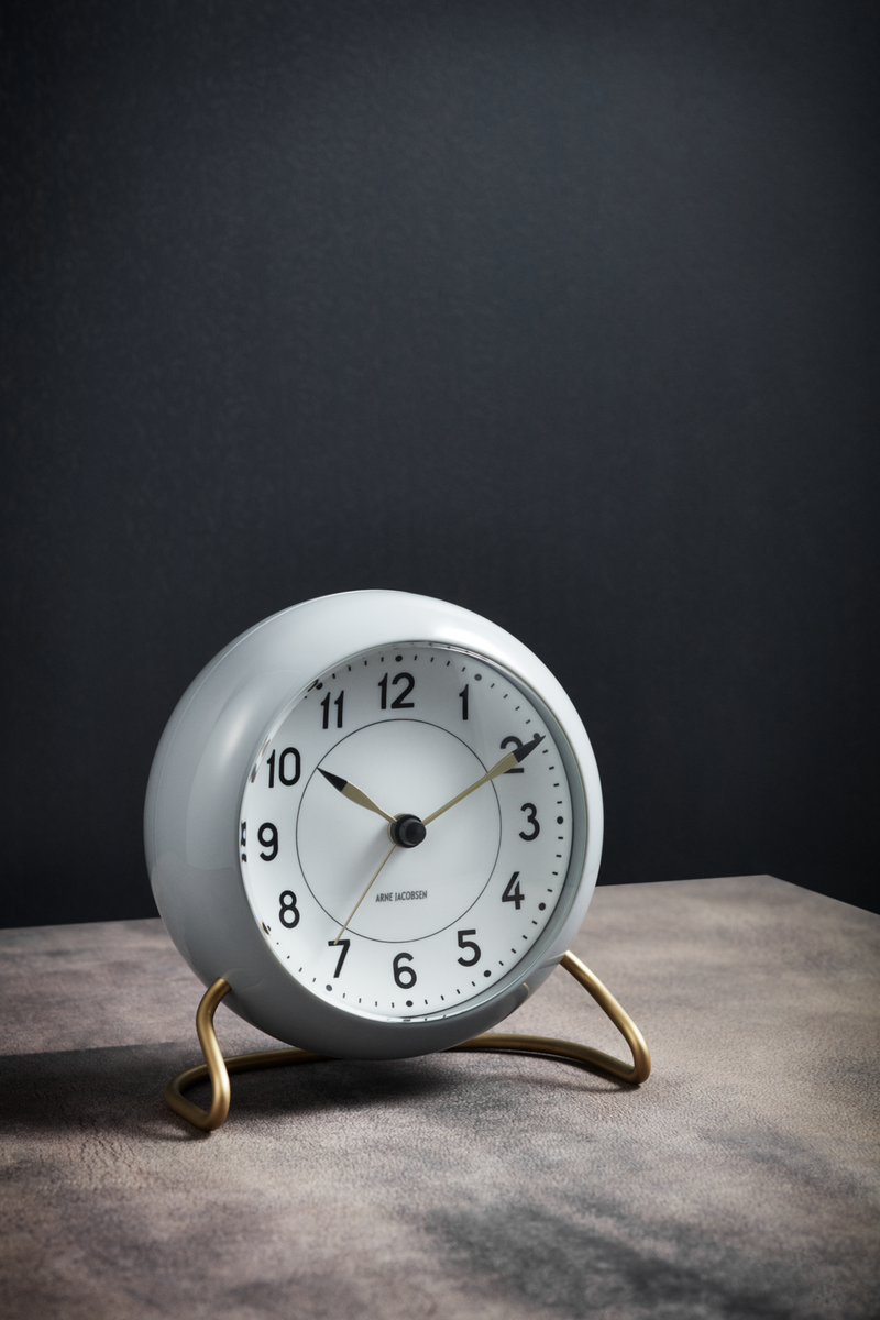 Arne Jacobsen Station Table Clock in Grey and White in an interior setting