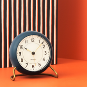 Arne Jacobsen Station Table Clock in Teal and White in an interior setting