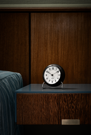 Arne Jacobsen Station Table Clock in White and Black in an interior setting