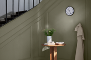 Arne Jacobsen Station Wall Clock in White and Black in an interior setting