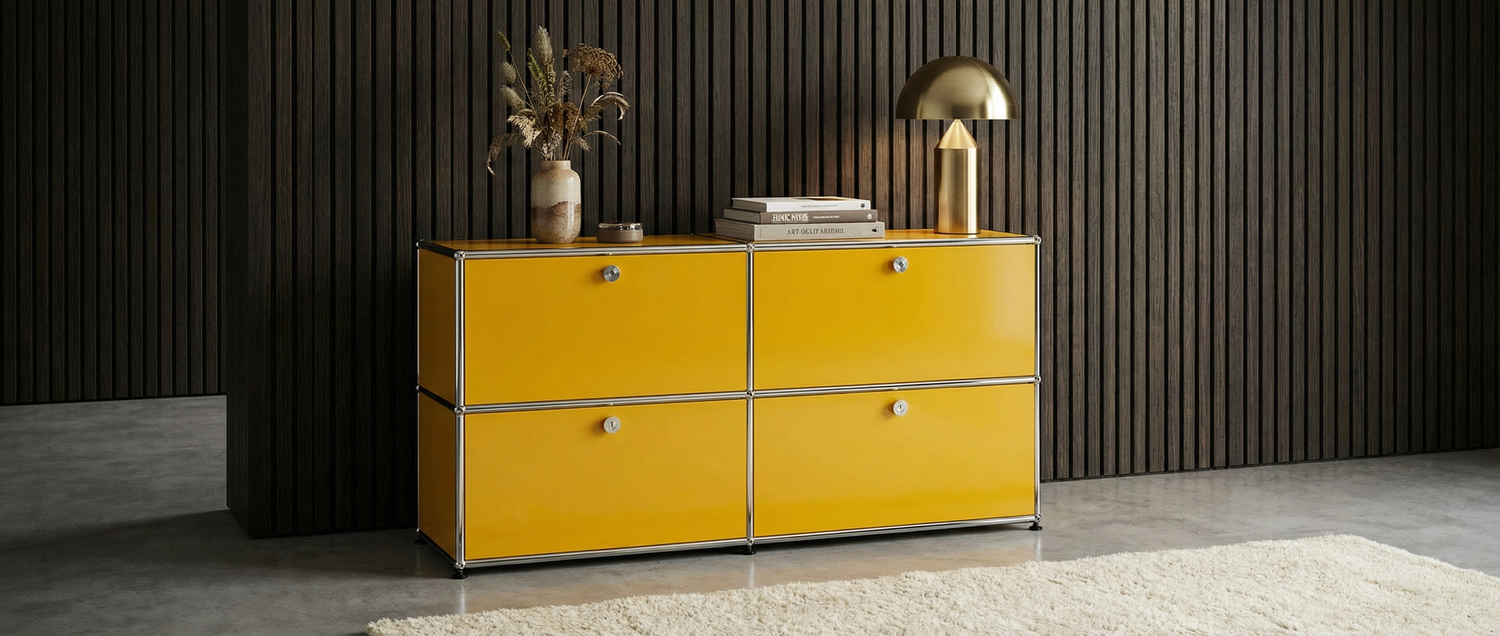 Yellow dresser with decorative items against a dark paneled wall.