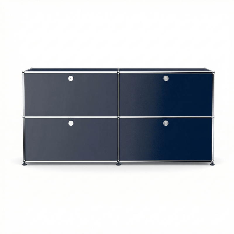 USM Haller Credenza E2 in navy blue with four drop-down doors, chrome frame, and modern modular storage design on a white background.