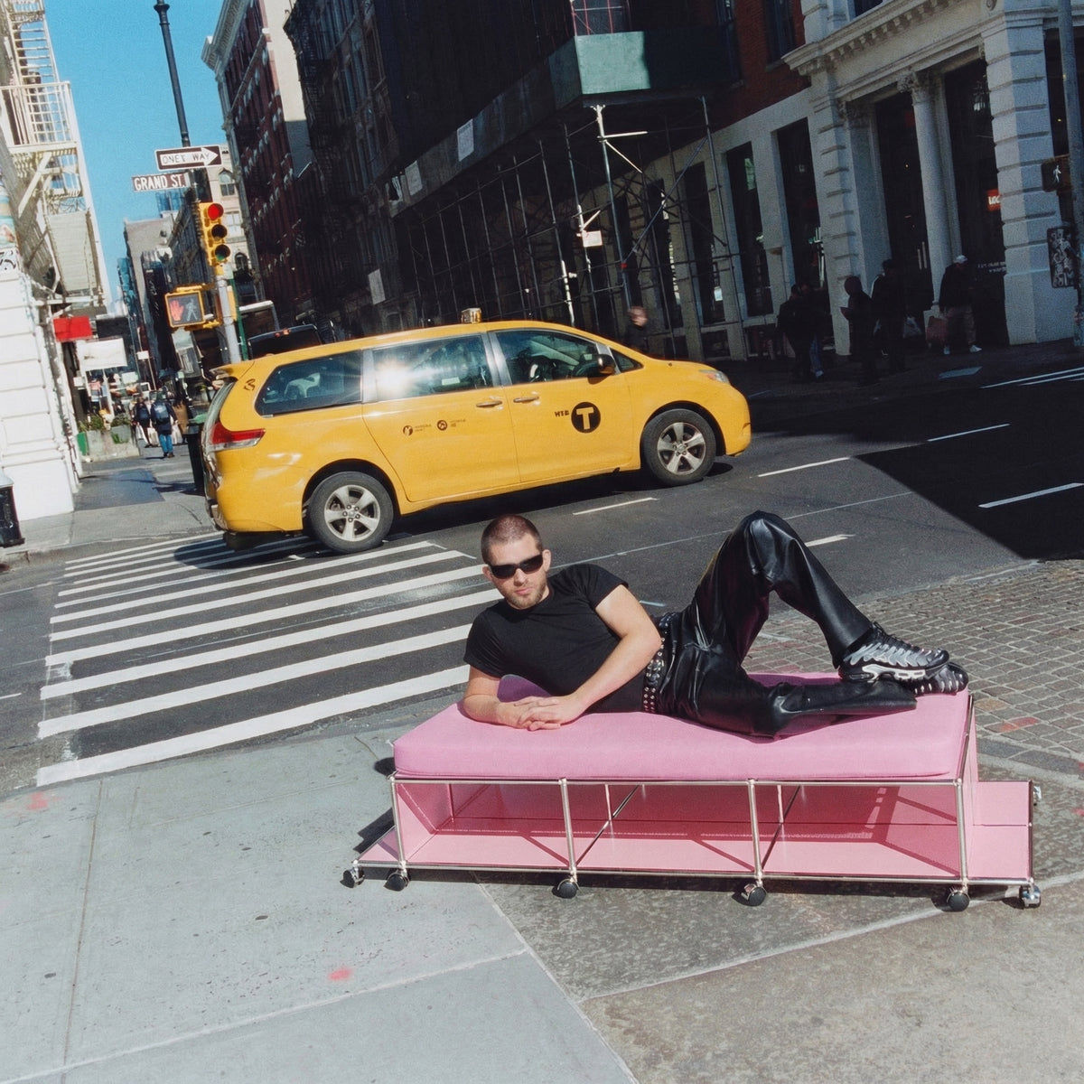 USM NYC Central Lounge in Downtown Pink placed on a New York City street with a yellow taxi in view